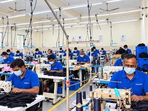 Enhanced visualisation of Sungrace sewing workstations with masked tailors and safety signs