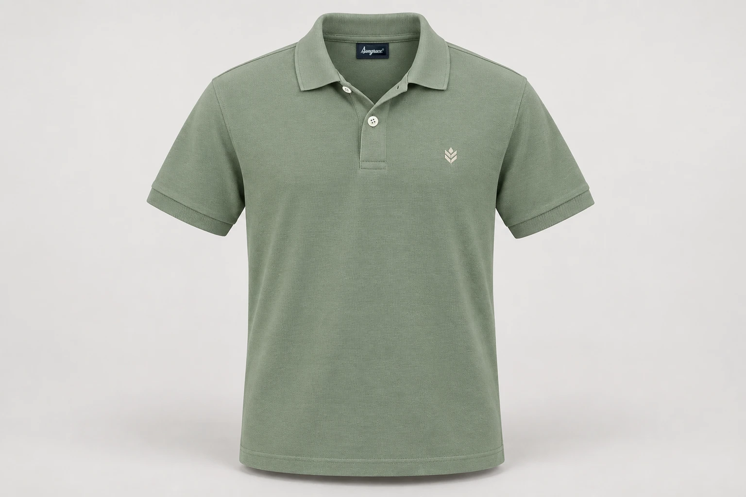 Corporate Polo Shirts — Unisex muted sage-green short-sleeve cotton pique polo, tonal rib collar and cuffs, two pearl four-hole placket buttons, no pocket, small original cream geometric wearer-left chest embroidery. product front. Illustrative catalogue concept.