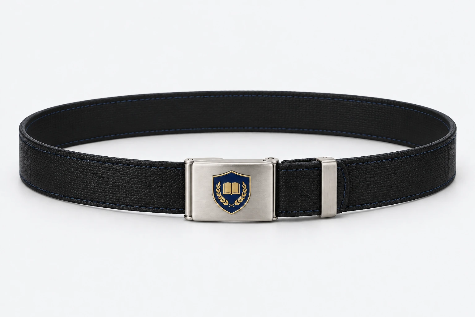 School Belts — black finely grained faux-leather with subtle navy edge stitch, polished silver rectangular plate buckle. product. Illustrative catalogue concept.