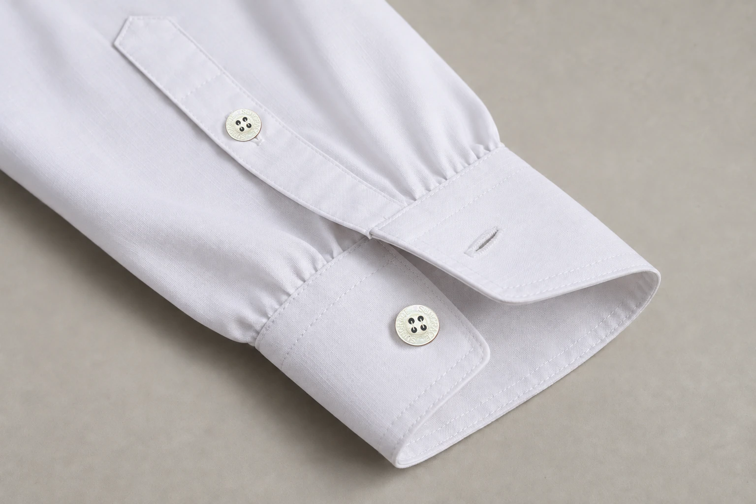 Full-Sleeve School Shirts — White classic cuff and sleeve placket. macro cuff construction detail photograph. Illustrative catalogue concept.