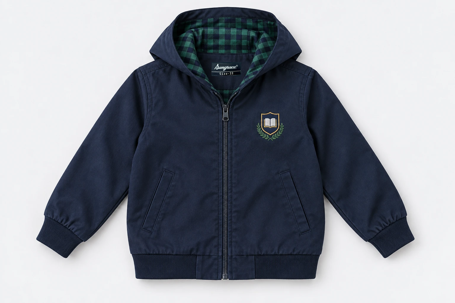 School Jackets for Small Children — navy cotton twill school jacket with simple hood laid flat showing small green and navy checked lining, front zip, no drawstrings, cuffed sleeves. product. Illustrative catalogue concept.