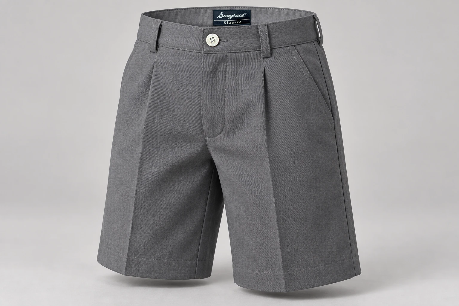 School Shorts — Grey pleated. front three-quarter product photograph. Illustrative catalogue concept.