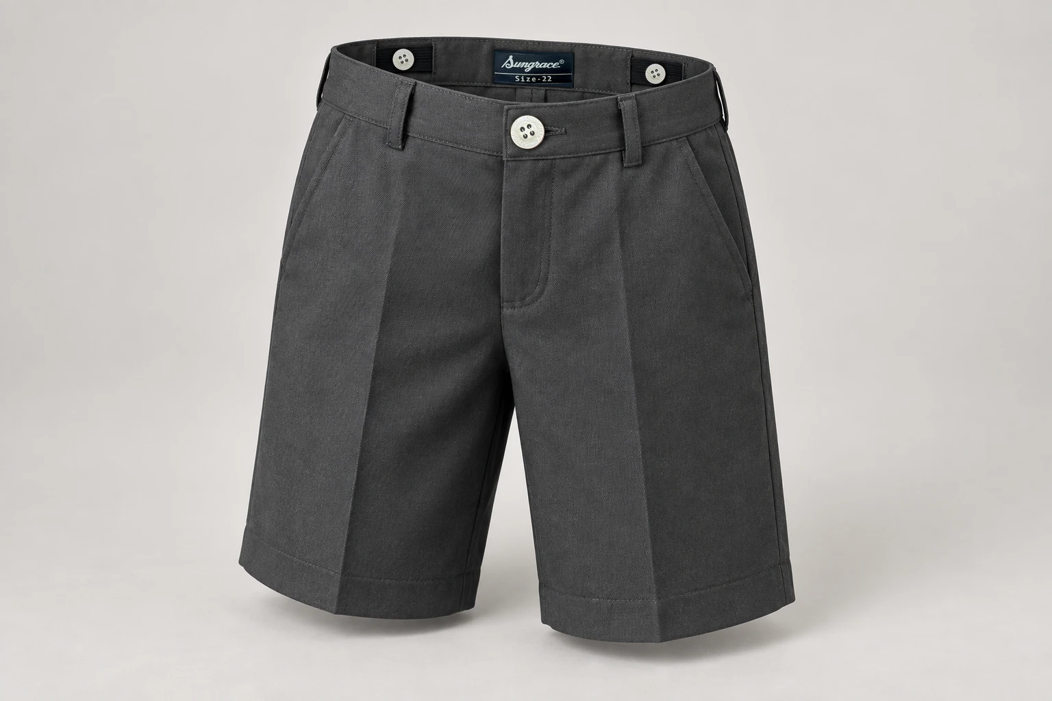 School Shorts — Charcoal adjustable waist. front three-quarter product photograph. Illustrative catalogue concept.