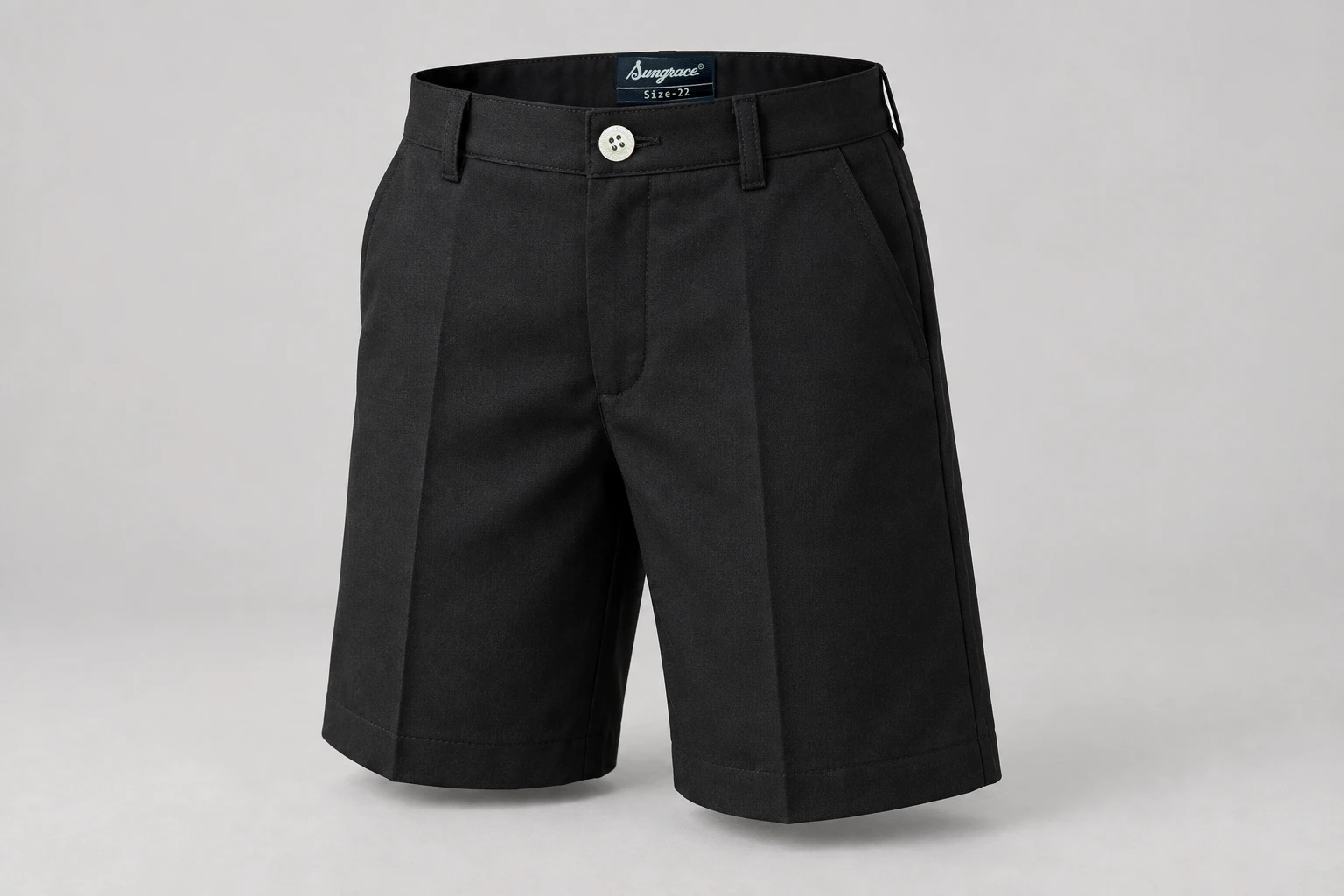 School Shorts — Black school short. front three-quarter product photograph. Illustrative catalogue concept.