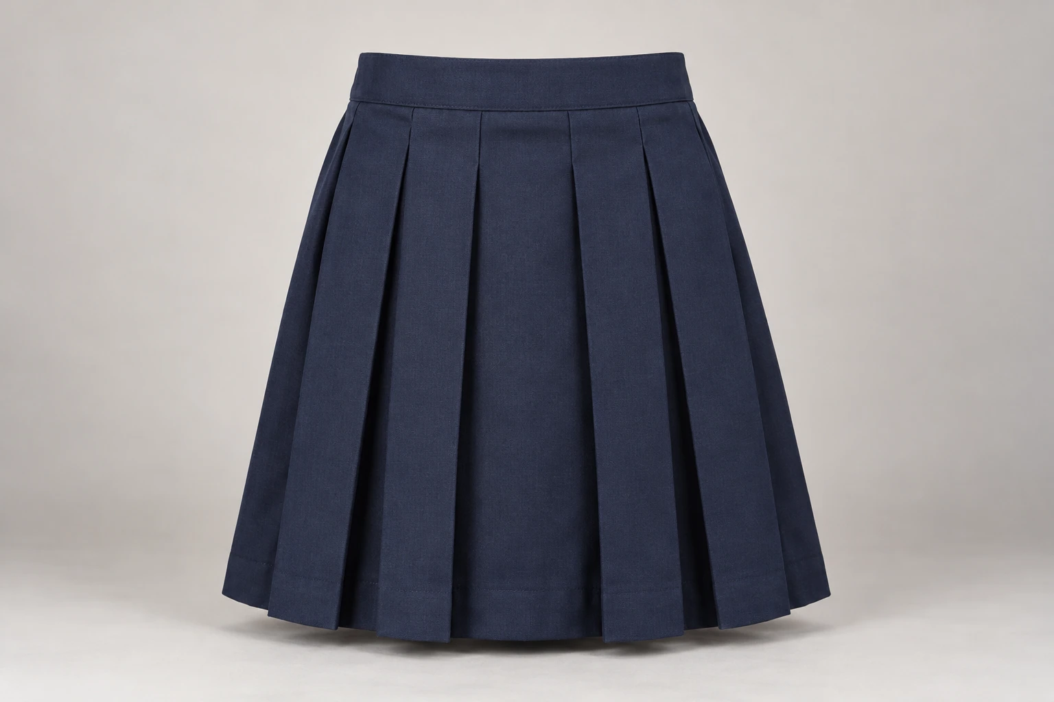 School Skirts — Navy box pleat. front product photograph. Illustrative catalogue concept.