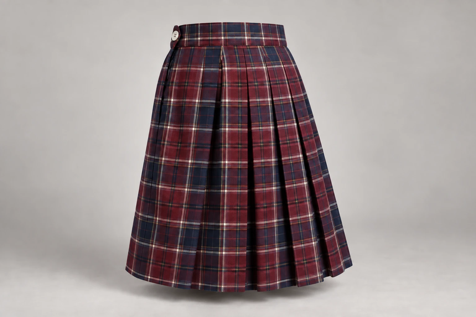 School Skirts — Burgundy tartan. rear three-quarter product photograph. Illustrative catalogue concept.