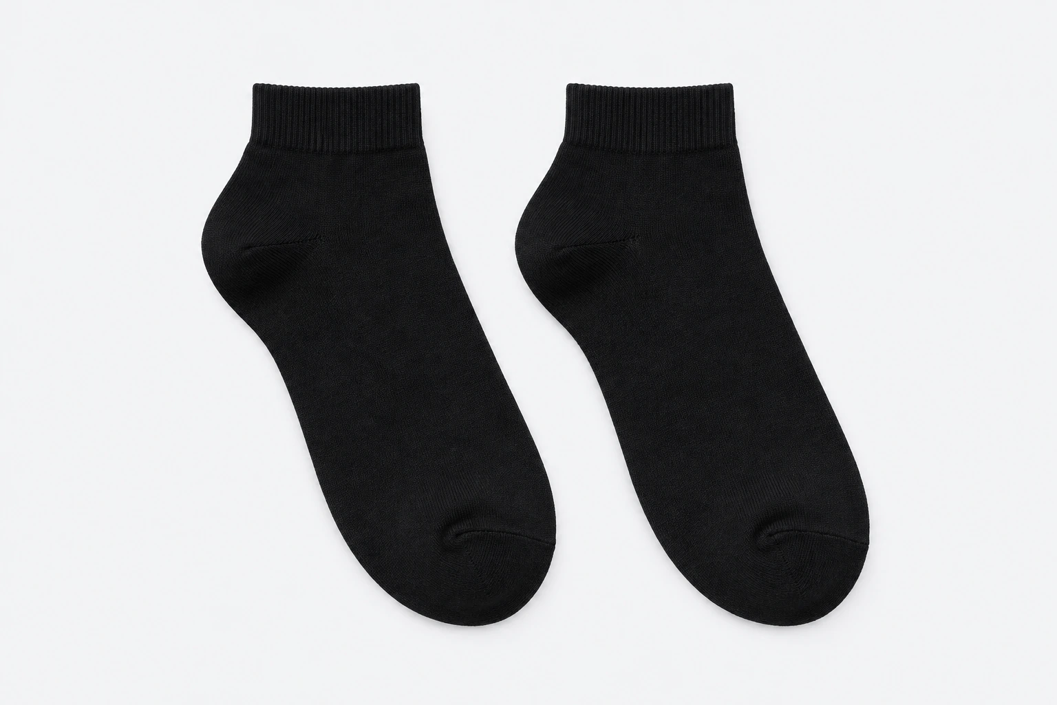 School Socks — plain black ankle socks. product. Illustrative catalogue concept.