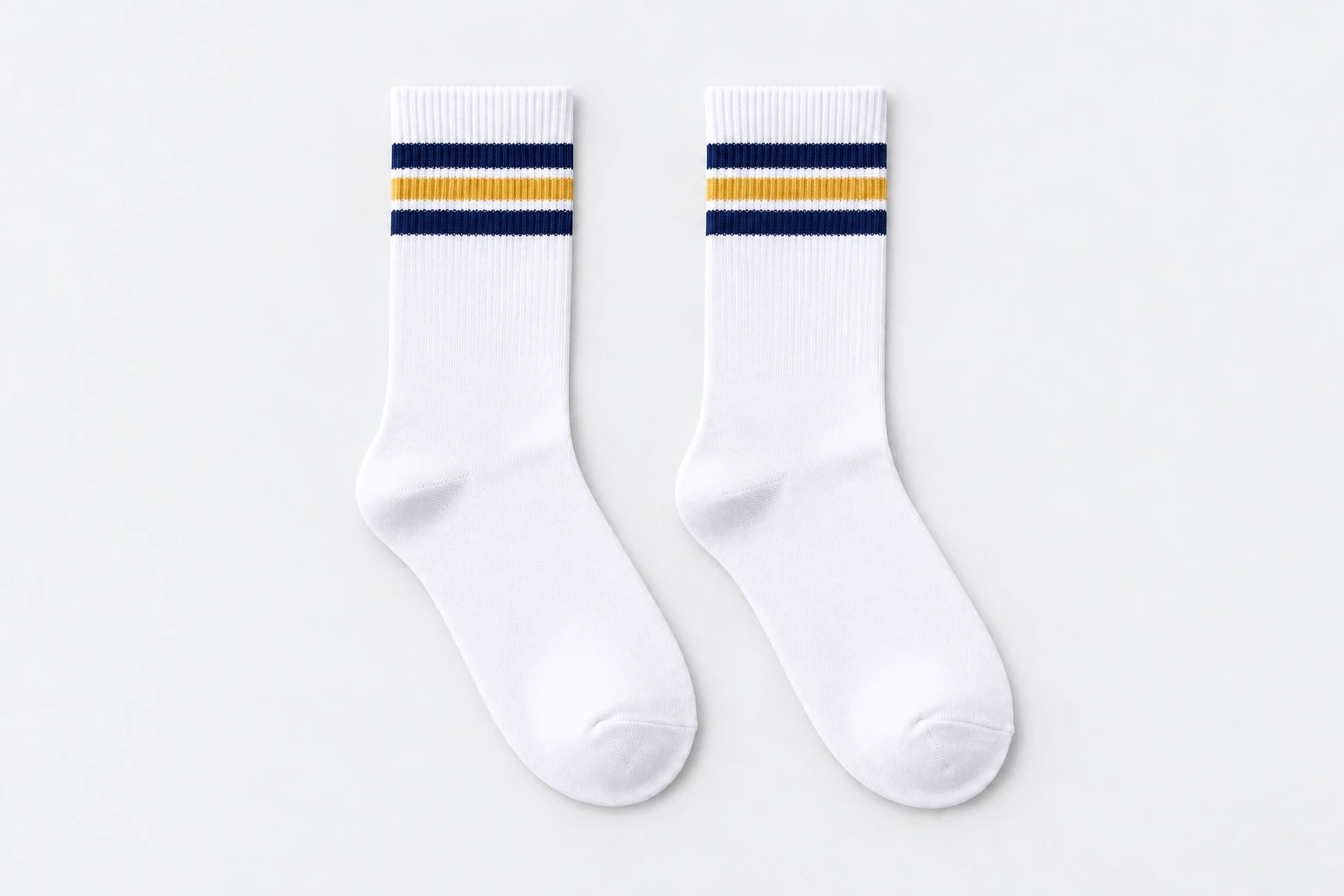 School Socks — white crew socks with navy-gold-navy knitted cuff bands. product. Illustrative catalogue concept.