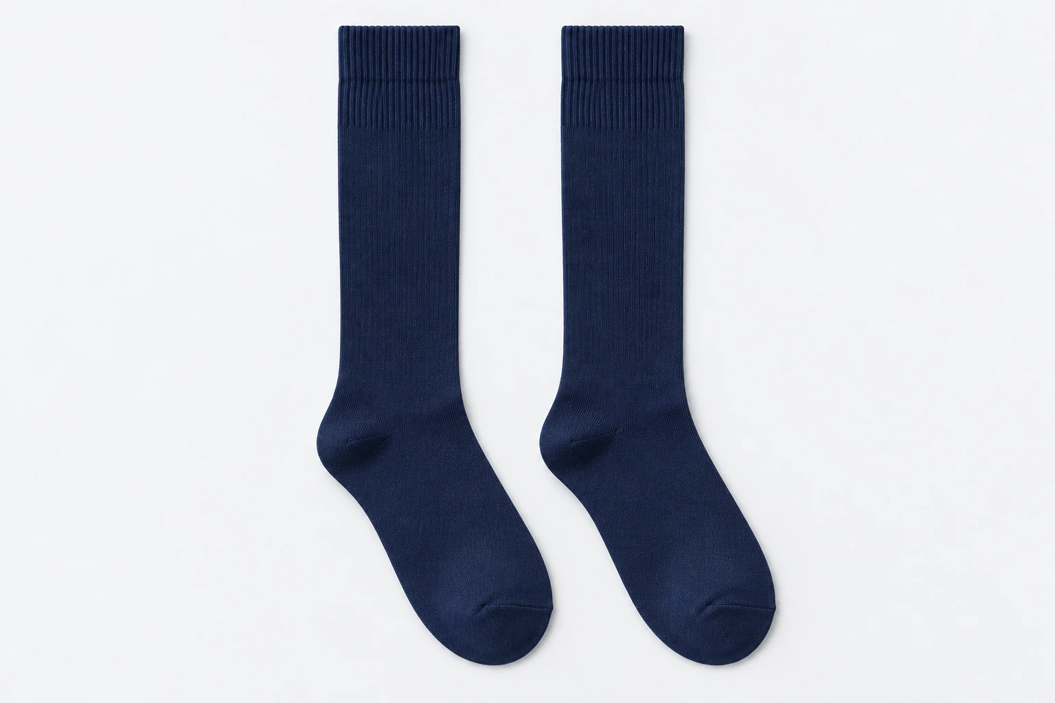 School Socks — navy knee-high ribbed socks. product. Illustrative catalogue concept.