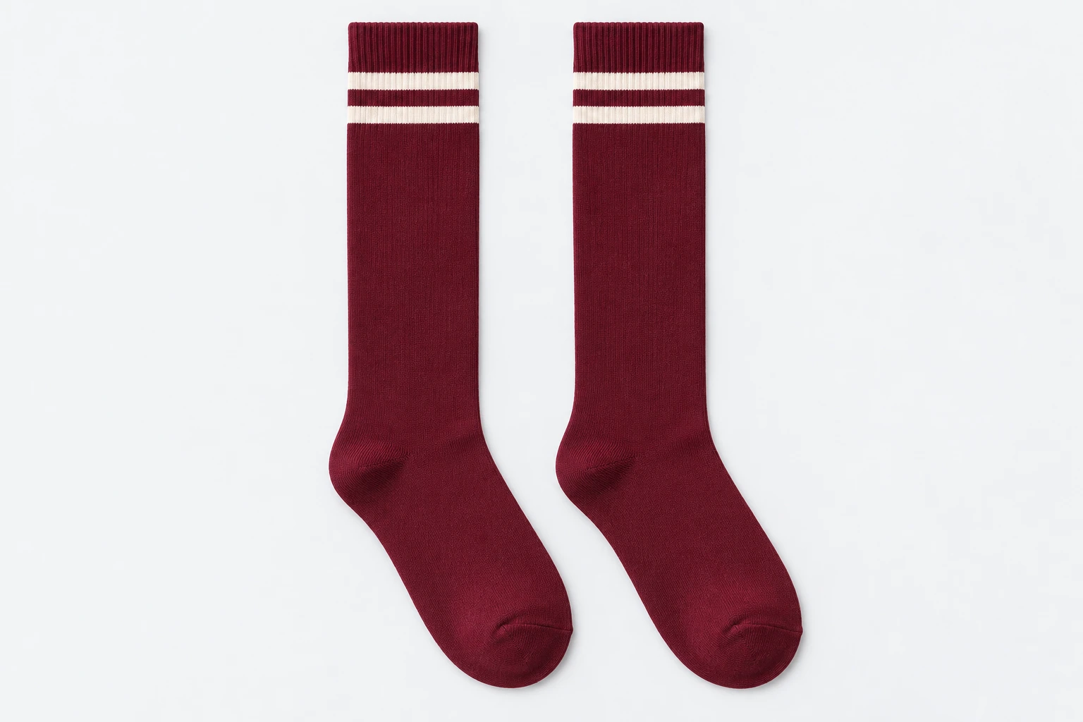 School Socks — burgundy knee-high socks with two cream cuff bands. product. Illustrative catalogue concept.