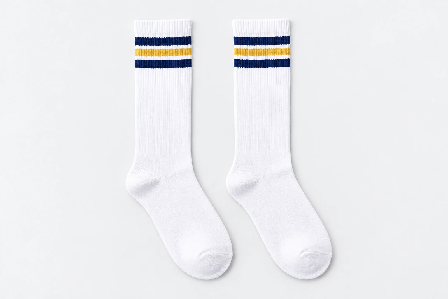 School Socks — white knee-high socks with two navy and one gold cuff bands. product. Illustrative catalogue concept.