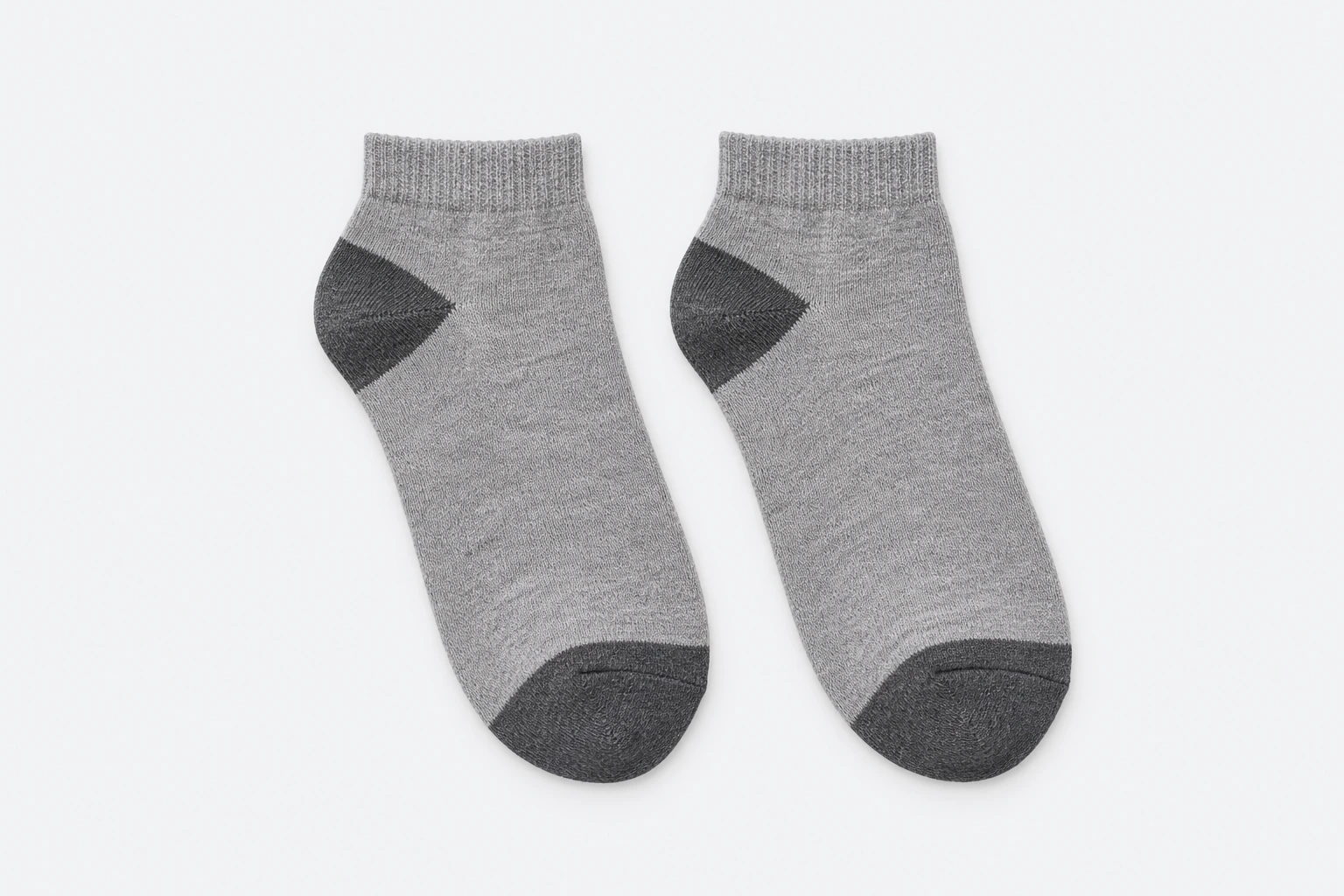 School Socks — grey marl short-cuff socks with darker grey heel and toe reinforcement. product. Illustrative catalogue concept.