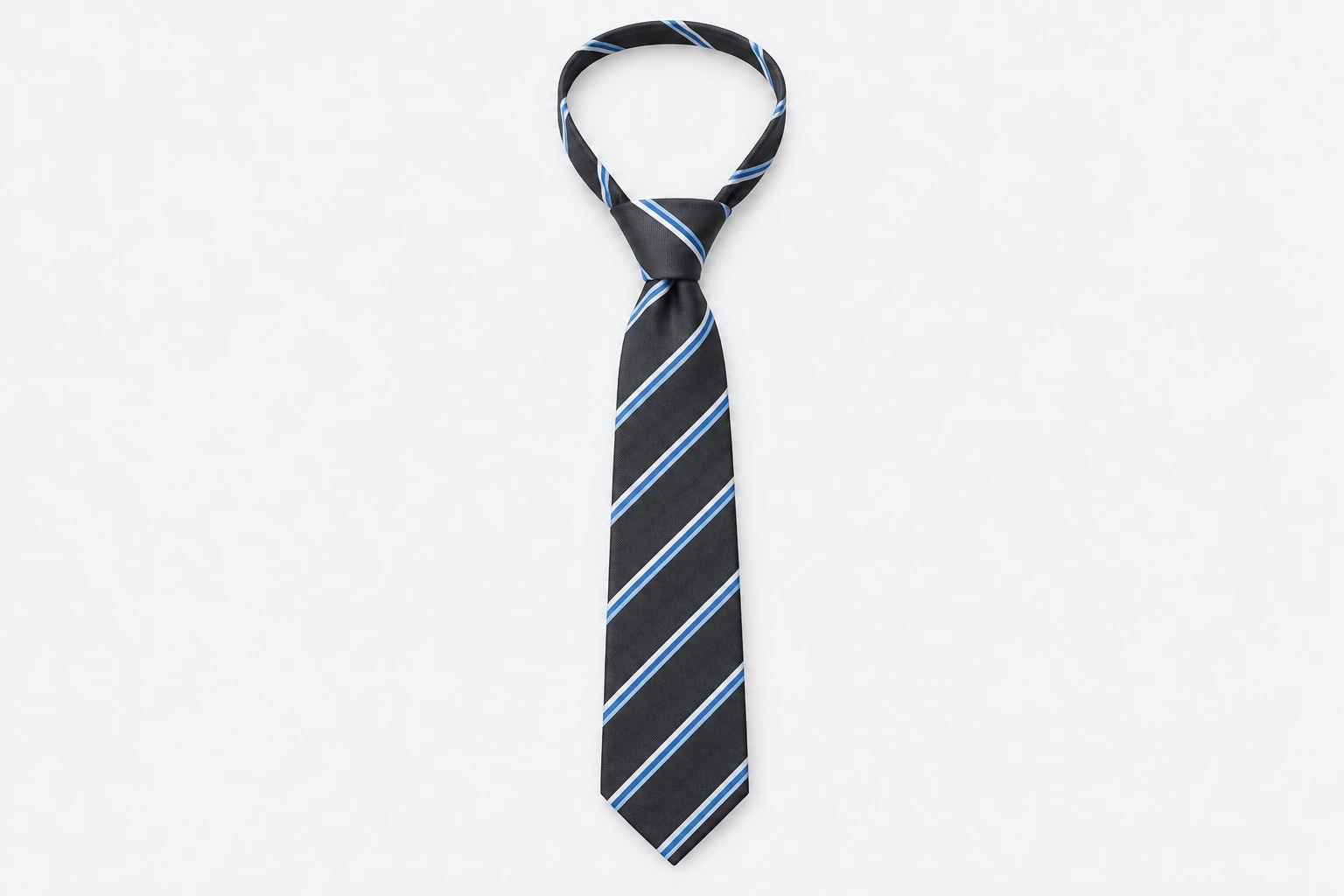 School Ties — charcoal slim tie with sky-blue and white narrow diagonal stripes. product. Illustrative catalogue concept.