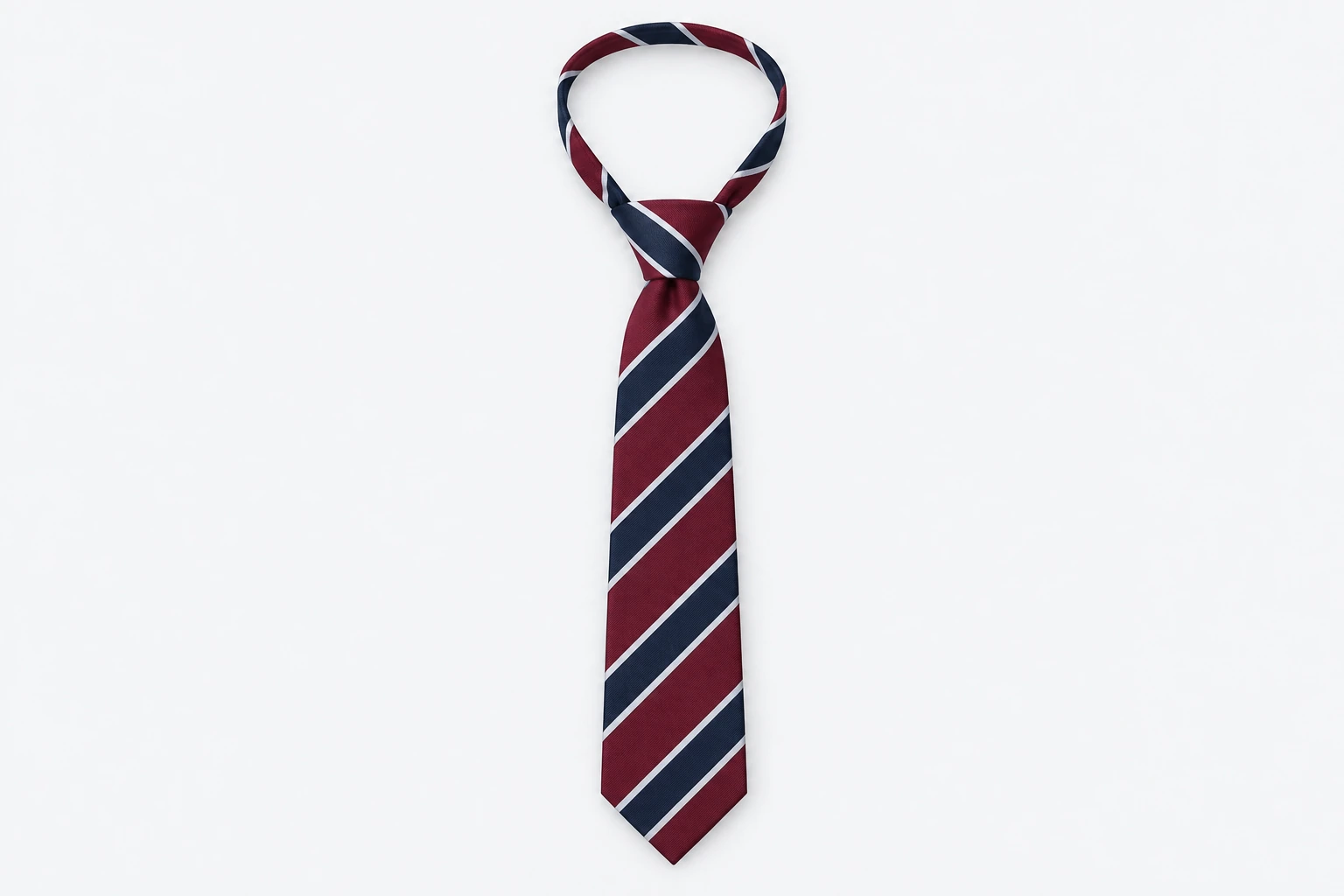 School Ties — burgundy tie with wide navy diagonal regimental stripes edged in white. product. Illustrative catalogue concept.