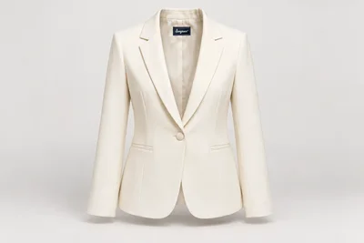 Blazers — Women's ivory one-button blazer with notch lapels and restrained welt hip pockets, ivory covered button. product front. Illustrative catalogue concept.