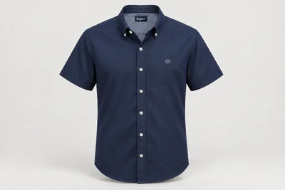 Corporate Shirts — Navy Oxford unisex short-sleeve shirt, button-down collar, no pocket, small original silver geometric chest embroidery. product front. Illustrative catalogue concept.