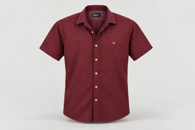 Corporate Shirts — Muted burgundy unisex short-sleeve shirt, semi-spread collar, no pocket, original tiny cream geometric chest embroidery. product front. Illustrative catalogue concept.