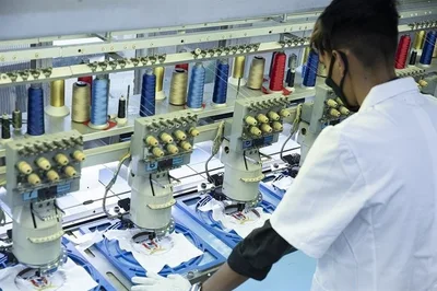 Multi-head embroidery equipment at work on garments