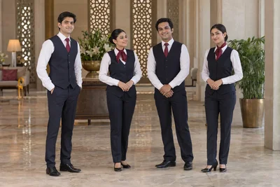 Catalogue design concept: A Warm Welcome. Navy waistcoats, white shirts and burgundy accents. North Indian models in an Indian setting.
