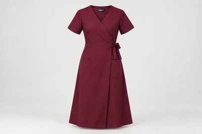 Nursing Dresses — Women’s wine below-knee mock-wrap nursing dress, short sleeves, secure closed V neckline and two lower pockets. product front. Illustrative catalogue concept.