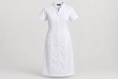 Nursing Dresses — Women’s white below-knee nursing dress, short sleeves, low stand collar and concealed snap placket. product front. Illustrative catalogue concept.
