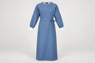OT and Procedure Gowns — Unisex steel-blue ankle-length cloth procedure-gown concept, raglan sleeves, white knit cuffs and tie waist. product front. Illustrative catalogue concept.