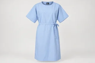 Patient Gowns — Unisex pale-blue knee-length patient gown with wide short sleeves, round neckline and overlapping rear tie closure. product front. Illustrative catalogue concept.