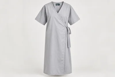 Patient Gowns — Unisex light-grey relaxed below-knee patient gown with generous wrap overlap and fabric waist ties. product front. Illustrative catalogue concept.