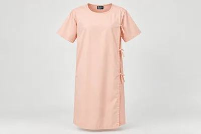 Patient Gowns — Unisex pale peach below-knee patient gown, short sleeves, full rear overlap and compact tie tabs. product front. Illustrative catalogue concept.
