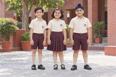 Catalogue design concept: Junior Checks. Cream and fawn tops with red-and-navy checked junior uniforms. North Indian models in an Indian setting.