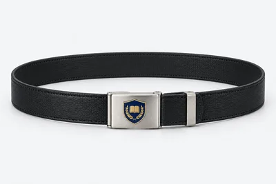 School Belts — black fine-grain faux-leather, silver rectangular plate buckle. product. Illustrative catalogue concept.