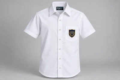 Half-Sleeve School Shirts — white with navy and gold sample shield crest. front product photograph. Illustrative catalogue concept.