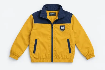 School Jackets for Small Children — mustard gold lightweight windcheater, navy stand collar and shoulder yoke, navy front zip and two welt hand pockets. product. Illustrative catalogue concept.