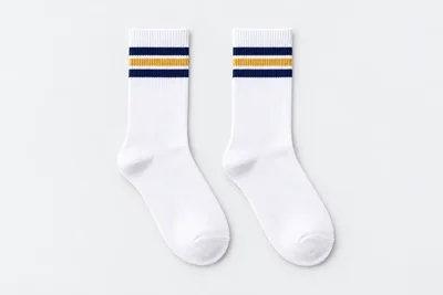 School Socks — white crew socks with navy-gold-navy knitted cuff bands. product. Illustrative catalogue concept.