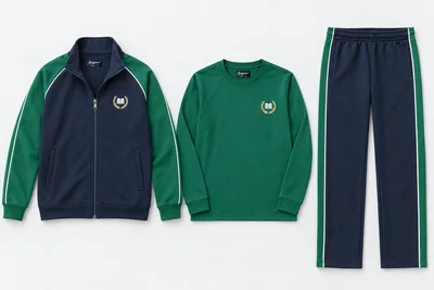 Winter School Tracksuits — Three-Piece Sets — navy zip stand-collar upper with emerald green raglan sleeves and white fine piping; navy straight lowers with emerald green broad outer-leg stripe bordered white; emerald green full-sleeve round-neck T-shirt. Custom house-colour options: red, royal blue, green and yellow.. product. Illustrative catalogue concept.