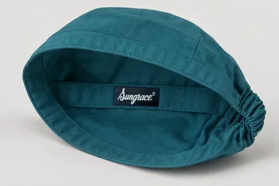 Scrub Caps — Teal woven scrub cap with modest crown and elastic rear band. product rear three-quarter. Illustrative catalogue concept.