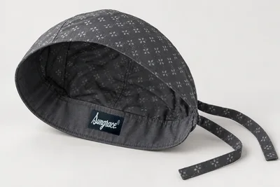 Scrub Caps — Graphite woven scrub cap with small original pale-grey geometric print and ties. product rear three-quarter. Illustrative catalogue concept.