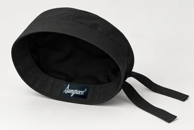 Scrub Caps — Black low-profile woven scrub cap with clean solid band and ties. product rear three-quarter. Illustrative catalogue concept.