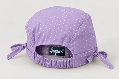 Scrub Caps — Lilac woven scrub cap with tiny original white dots and elastic rear section. product rear three-quarter. Illustrative catalogue concept.