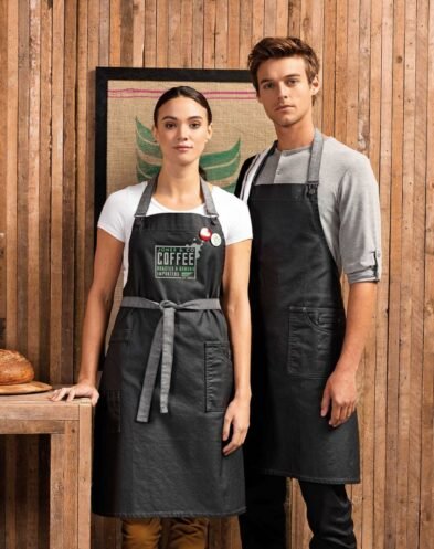 India`s Largest Uniforms Manufacturer | Sungrace Uniforms premier-pr134-district-waxed-look-denim-bib-apron-46972-pekm849x1073ekm-393x497 Hospitality Uniforms  